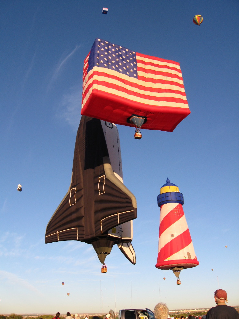 The space shuttle and the American flag have a near miss